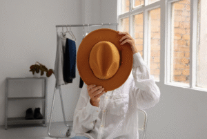 What to Wear for a Family Photoshoot? - A girl behind a orange hat.